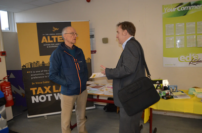 Vice Chair Tony Vickers (left) talks to a delegate