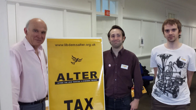 Vince Cable visits ALTER stand at SLF conference, with members Toby Matthews and Daniel Henry.